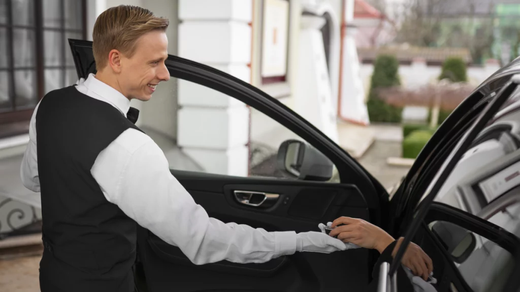Black luxury sedan parked in downtown Austin for chauffeur pickup