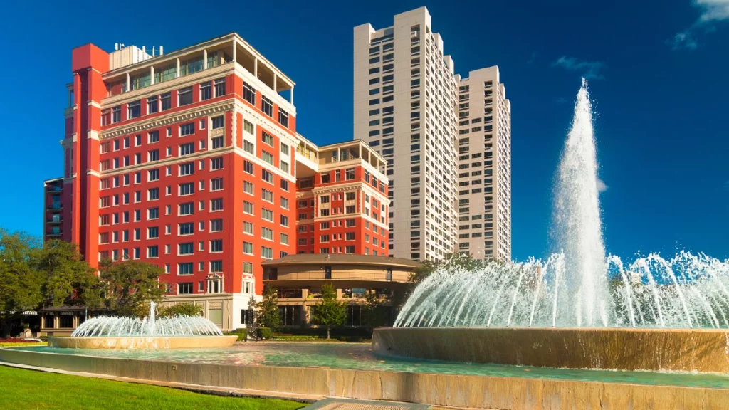 Luxury black car arriving at Hotel ZaZa Houston for airport pickup