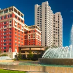Luxury black car arriving at Hotel ZaZa Houston for airport pickup