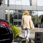 Houston airport limo service with black luxury sedan at IAH terminal