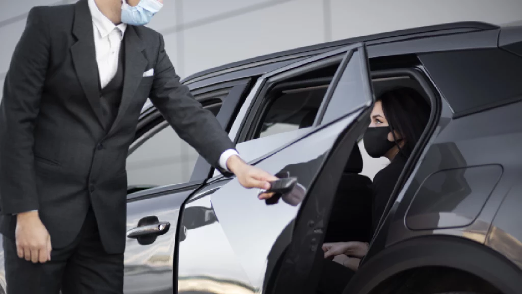 Chauffeur driving a luxury SUV from Houston TX to Dallas TX