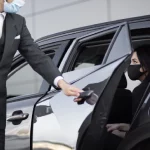 Chauffeur driving a luxury SUV from Houston TX to Dallas TX