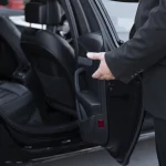 Chauffeur driving a luxury SUV on the Houston to San Antonio route