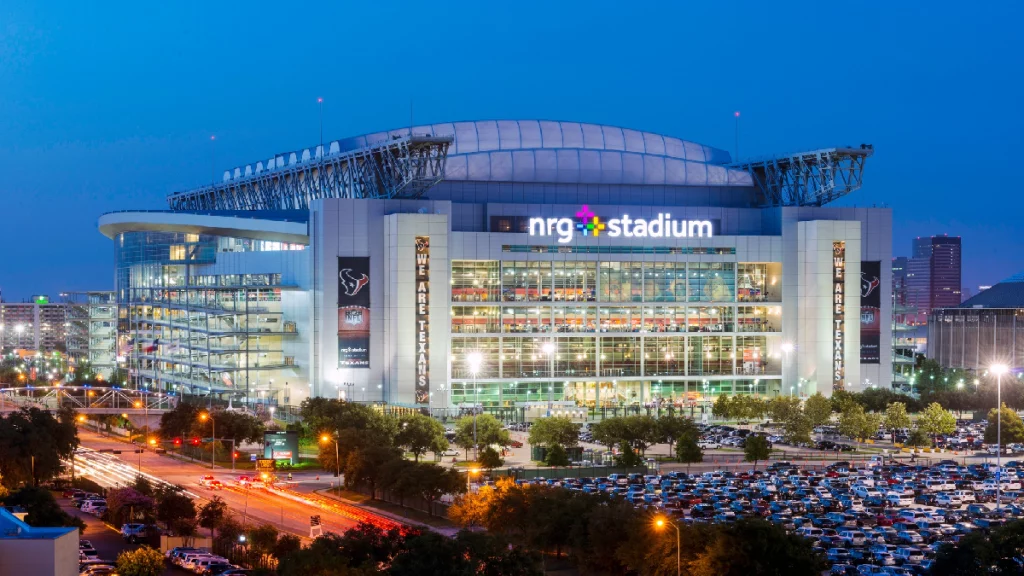 Shuttle to NRG Stadium in black van with fans arriving