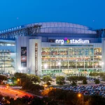 Shuttle to NRG Stadium in black van with fans arriving