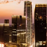 Black stretch limo and executive car parked outside SkyHouse Downtown Houston – SG World Transportation hourly and airport limo service.